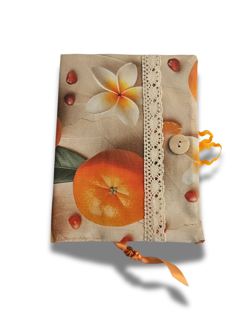 Decorative notebook with floral and fruit design on a white background
