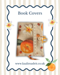 A promotional graphic for book covers featuring a central fabric-covered book cover design with orange fruit, white flowers, and lace trim, surrounded by a decorative blue border and the text 'Book Covers' and 'www.kaalimadeit.