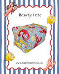 A square fabric beauty tote bag with a lobster and lemon print, centered on a white background with a blue and white striped border and decorative illustrations. The text 'Beauty Tote' appears above the bag, and 'www.