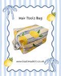 A handmade fabric hair tools bag with a yellow lemon and blue-gray striped pattern, shown on a white background with a decorative blue border, text reading 'Hair Tools Bag,' and the website 'www.kaalimadeit.