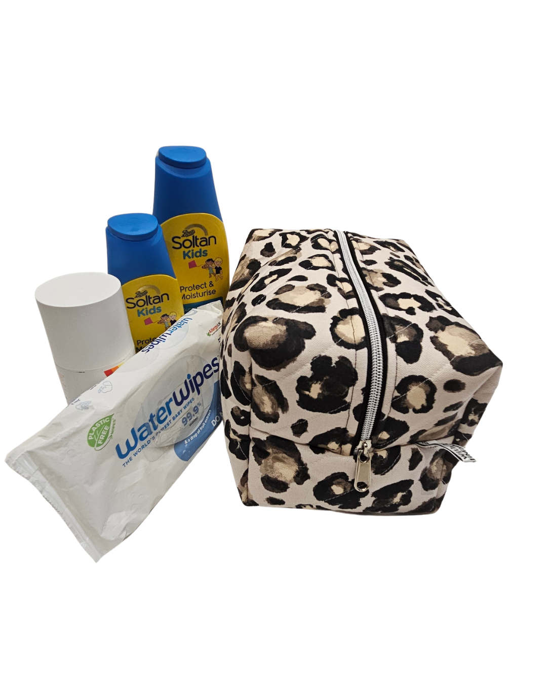 Leopard print toiletry bag with sun cream around it 