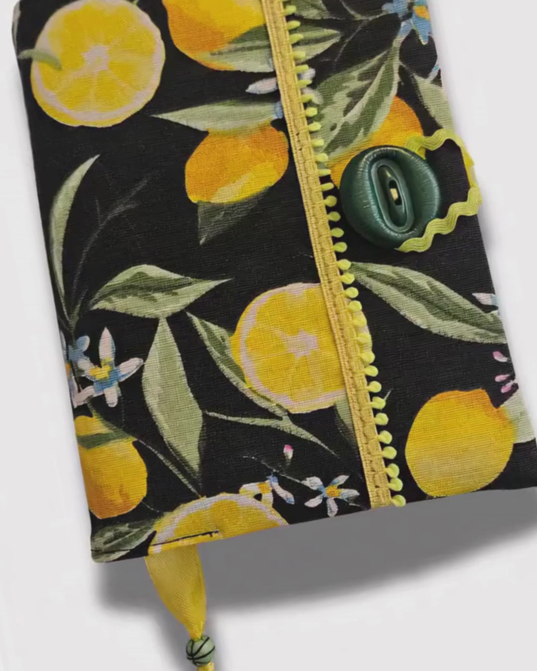 Notebook cover with lemon pattern on a black background